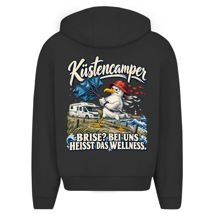 Küstencamper Hoodie „Brise? Bei uns heißt das Wellness.“ in Schwarz – Rückansicht mit Möwe, Regenschirm und Wohnmobil